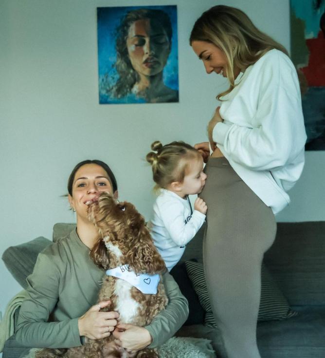 Matildas star Katrina Gorry is thrilled as her daughter Harper kisses the pregnant belly of her fiancee Clara Markstedt