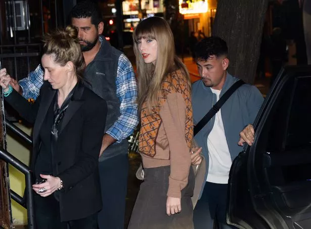 Taylor rocked an autumnal look on Friday, which comprised of brown and rust hues