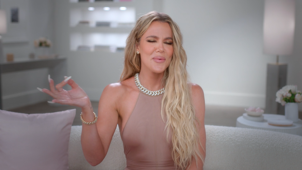 Khloe Kardashian twirls an imaginary sock in the air.