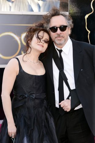 Actress Helena Bonham Carter and director Tim Burton arrive at the Oscars at Hollywood & Highland Center on February 24, 2013 in Hollywood, California.