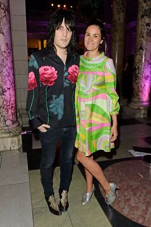 Noel Fielding (L) and Lliana Bird arrive at the Alexander McQueen: Savage Beauty VIP private view at the Victoria and Albert Museum on March 14, 2015 in London, England.