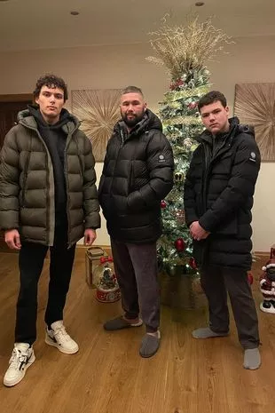 Tony Bellew poses in front of his Christmas tree