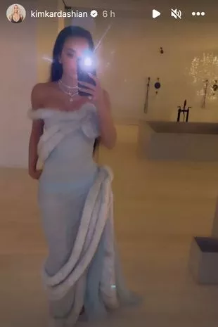 Kim Kardashian wore a fur-trimmed grey gown