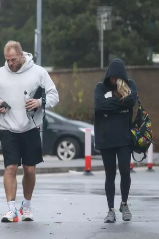 James looked at his phone as he was papped by a photographer