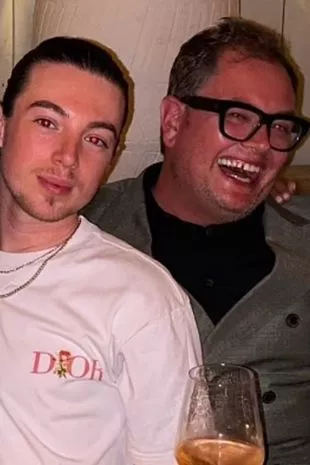 Alan Carr has reportedly found love with celebrity hairdresser Callum Heslop