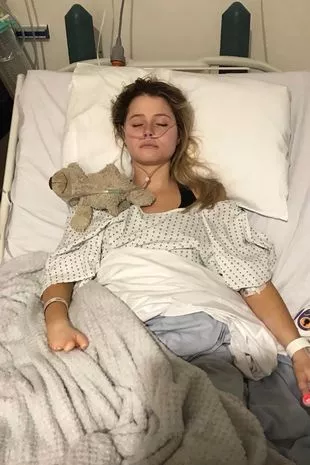 girl in hospital bed with tubes coming out of nose