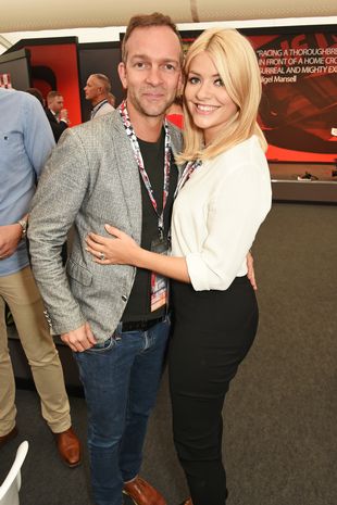 Dan Baldwin (L) and Holly Willoughby attend the British Grand Prix in the Driver Lounge at Silverstone on July 10, 2016 in Northampton, England.