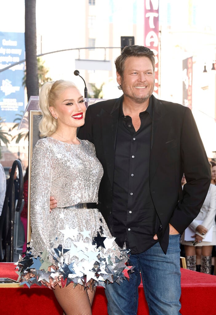 Gwen Stefani receives her star of fame while Blake Shelton stands by her side.