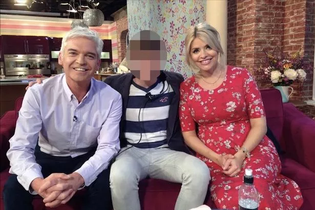 Phillip Schofield and his former partner on the set of This Morning with Holly Willoughby