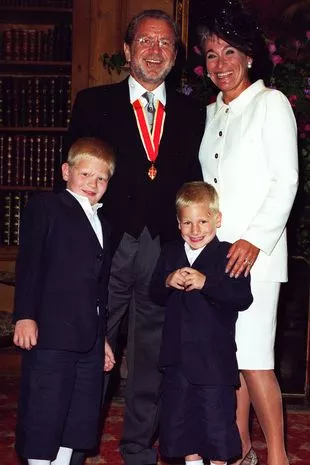 Sir Alan Sugar Chairman of Tottenham Hotspur FC and Lady Ann Sugar with their grandchildren Nathan and Matthew at his Knighthood