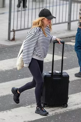 ellie walking with a case