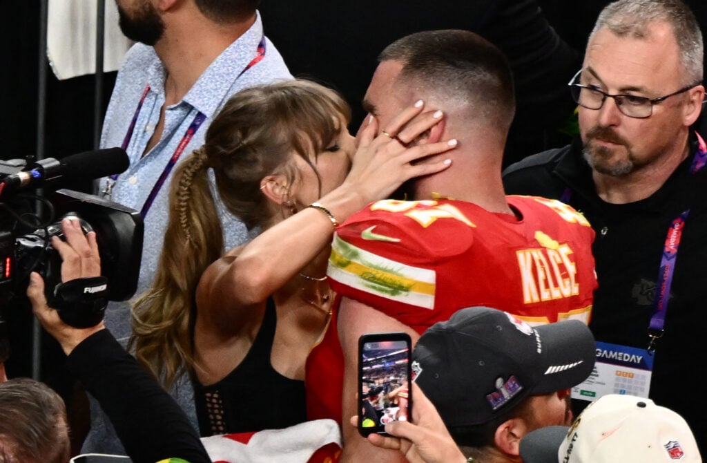 Taylor Swift kisses Kansas City Chiefs' tight end Travis Kelce after the Chiefs won Super Bowl LVIII against the San Francisco 49ers at Allegiant Stadium in Las Vegas, Nevada, February 11, 2024.