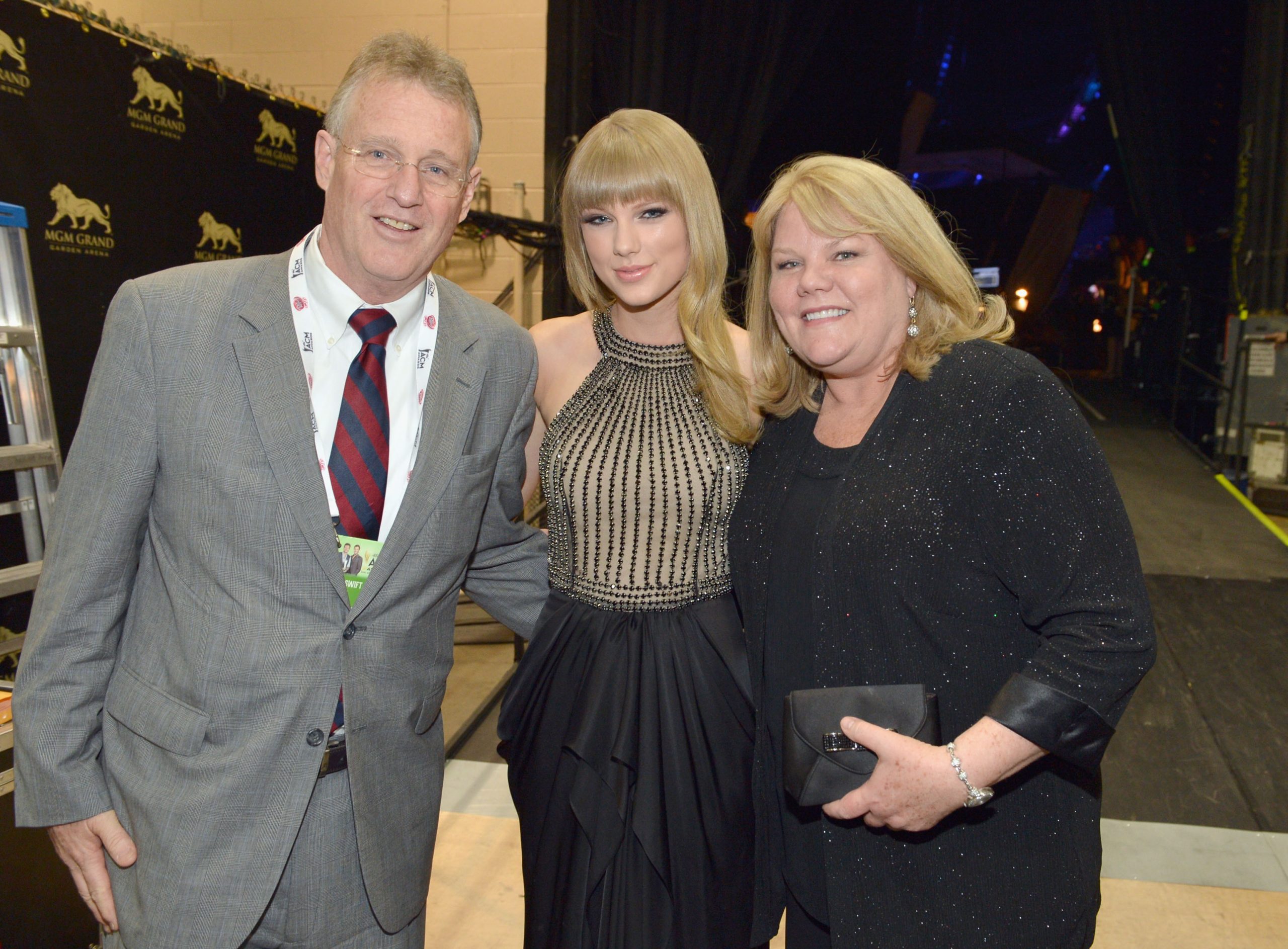 Taylor Swift and her parents Scott and Andrea Swift in 2013