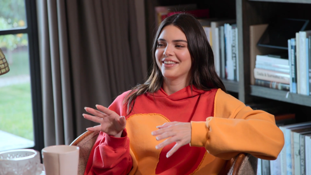 Kendall Jenner smiles and speaks.