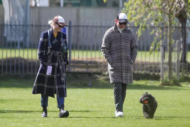 Holly Willoughby and husband Dan Baldwin take their dog for a walk at a London park ahead of Netflix move