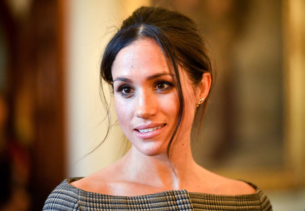 Meghan Markle chats with people inside the Drawing Room during a visit to Cardiff Castle on January 18, 2018 in Cardiff, Wales.