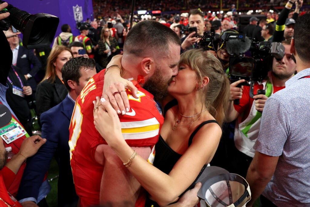 Travis Kelce and Taylor Swift lock lips in February of 2024.