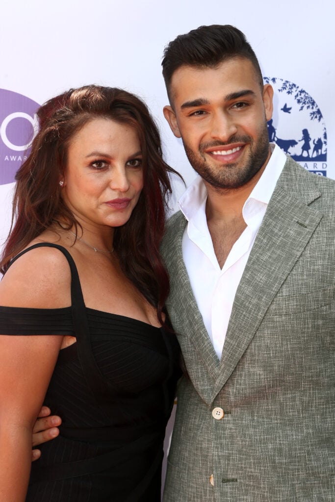 Britney Spears with brown hair in September of 2019, with Sam Asghari by her side.