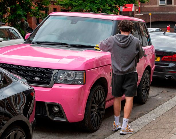 Katie's new boyfriend JJ is seen taking the parking ticket off her pink Range Rover