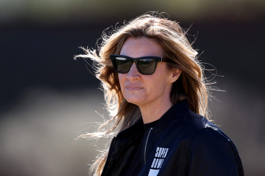 Erin Andrews watches a practice session for the Philadelphia Eagles prior to Super Bowl LVII at Arizona Cardinals Training Center on February 09, 2023 in Tempe, Arizona.