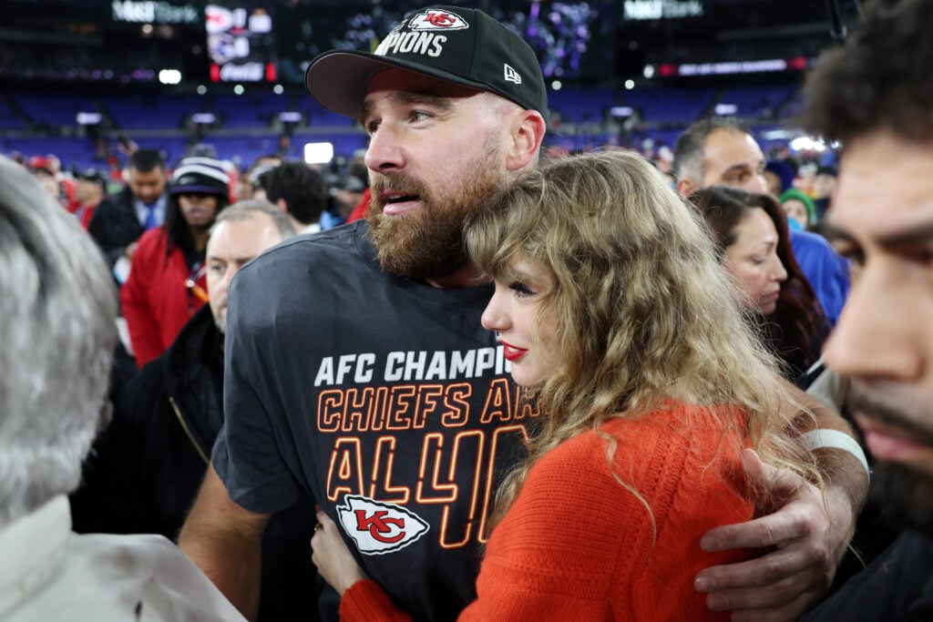 Travis Kelce of the Kansas City Chiefs celebrates with Taylor Swift after a 17-10 victory against the Baltimore Ravens in the AFC Championship Game at M&T Bank Stadium on January 28, 2024 in Baltimore, Maryland.