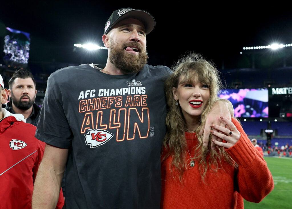 Travis Kelce of the Kansas City Chiefs celebrates with Taylor Swift after a 17-10 victory against the Baltimore Ravens in the AFC Championship Game at M&T Bank Stadium on January 28, 2024 in Baltimore, Maryland.