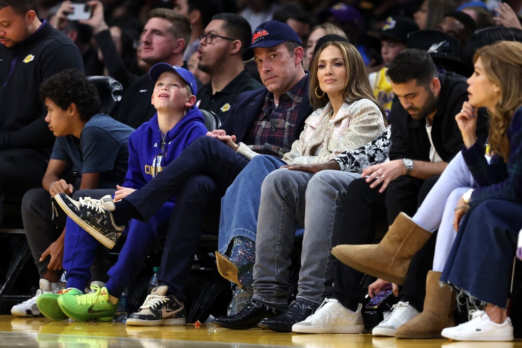 Ben Affleck and Jennifer Lopez look on from the front row during the first half of a game between the Golden State Warriors and the Los Angeles Lakers at Crypto.com Arena on March 16, 2024 in Los Angeles, California.