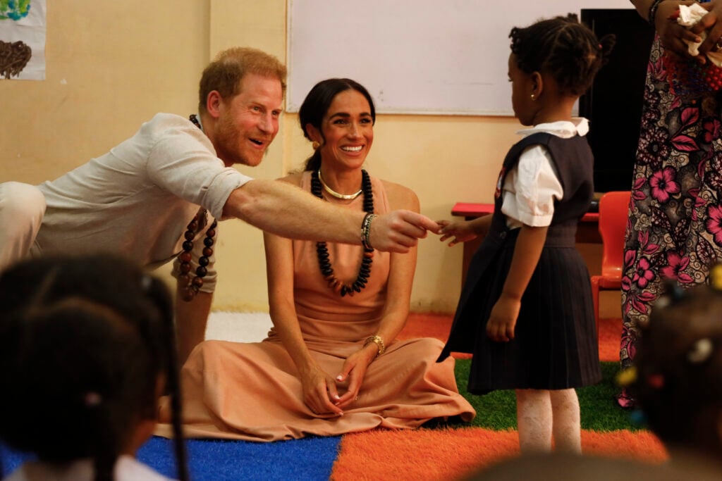 Prince Harry, Duke of Sussex and Meghan, Duchess of Sussex visit Lightway Academy on May 10, 2024 in Abuja, Nigeria.