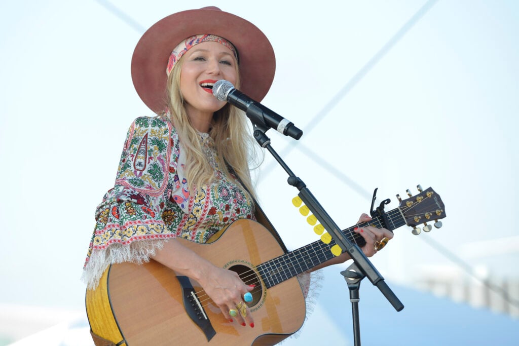 Jewel with a guitar in August of 2021.