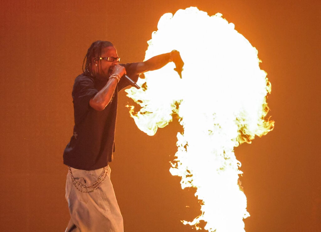 Travis Scott amidst pyrotechnics in September of 2023.