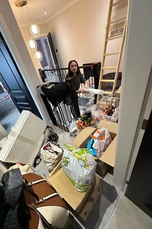 Emma McVey packs the house up ready to move out