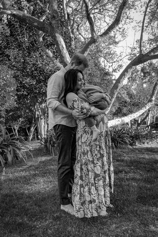 Prince Harry and his wife Meghan Markle, the Duke and Duchess of Sussex, posing with son Archie