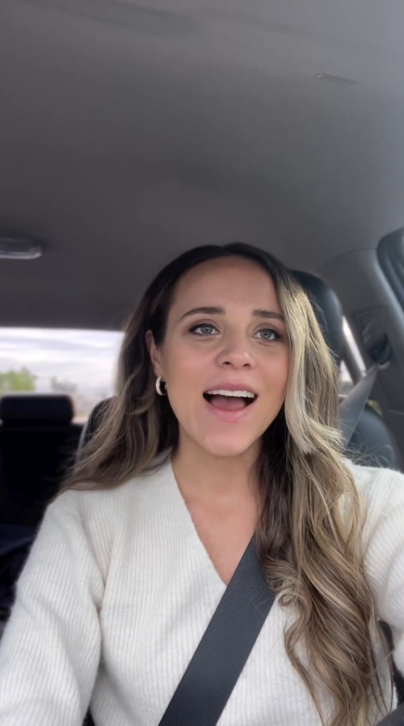 Jinger Duggar speaks excitedly while driving her car.