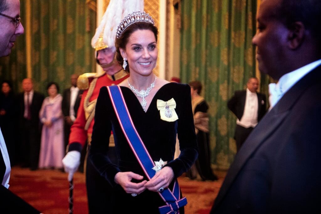 Catherine, Duchess of Cambridge talks to guests at an evening reception for members of the Diplomatic Corps at Buckingham Palace on December 11, 2019 in London, England.