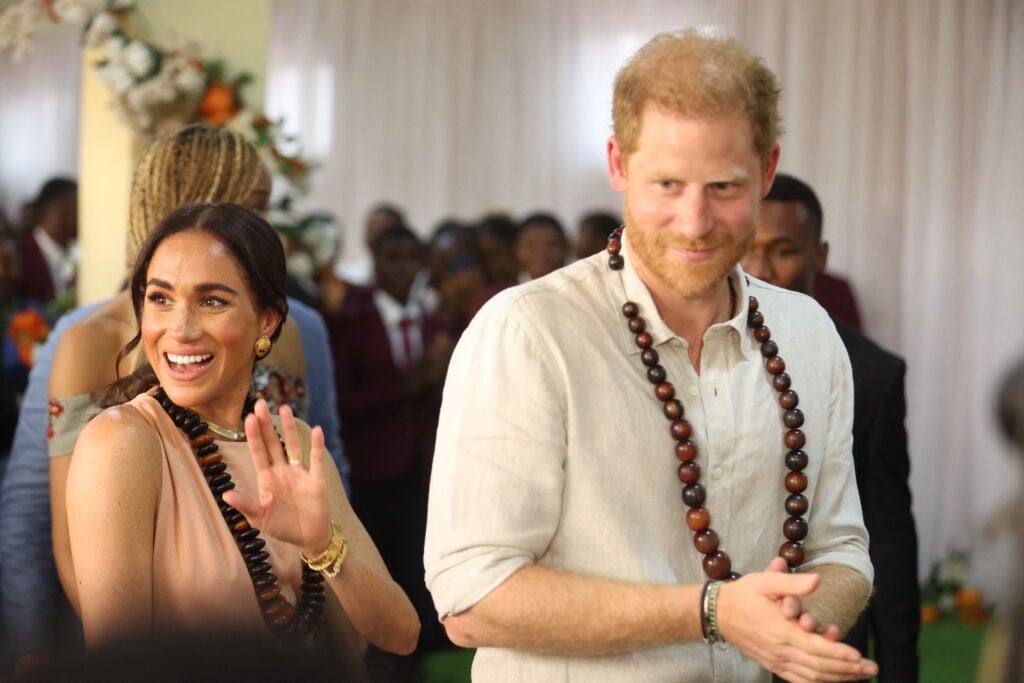 Britain's Prince Harry, Duke of Sussex, and Britain's Meghan, Duchess of Sussex, arrive at the Lightway Academy in Abuja on May 10, 2024 as they visit Nigeria as part of celebrations of Invictus Games anniversary. 