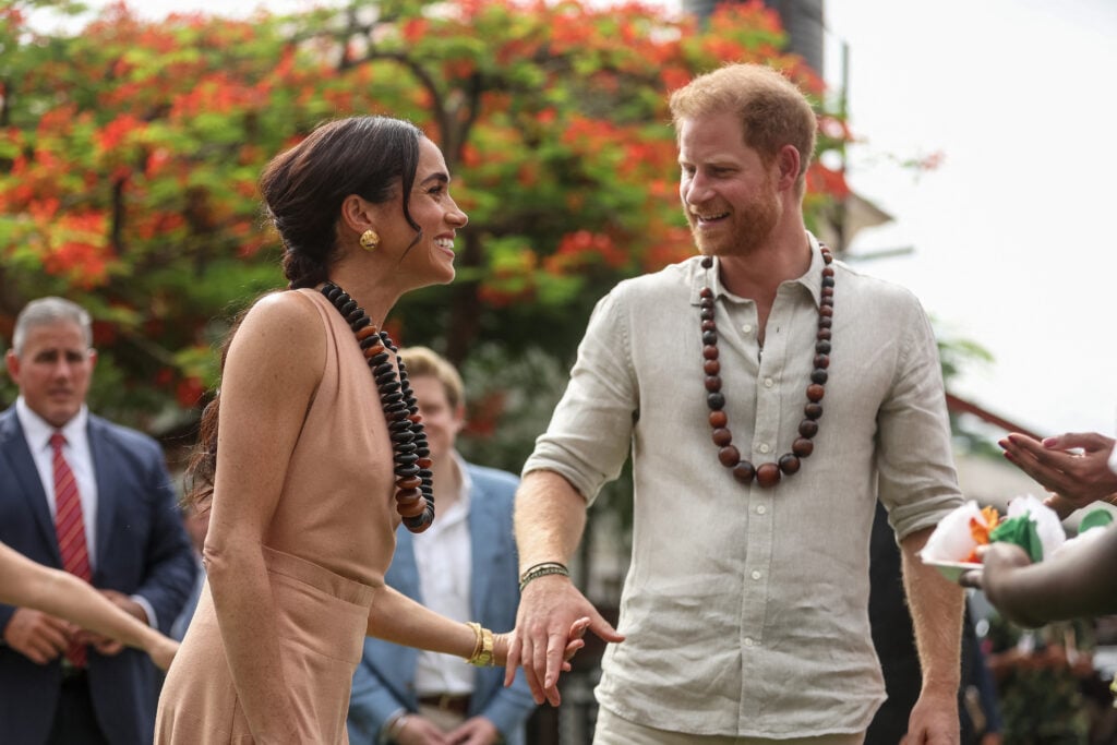 Britain's Prince Harry, Duke of Sussex, and Britain's Meghan, Duchess of Sussex, arrive at the Lightway Academy in Abuja on May 10, 2024 as they visit Nigeria as part of celebrations of Invictus Games anniversary.