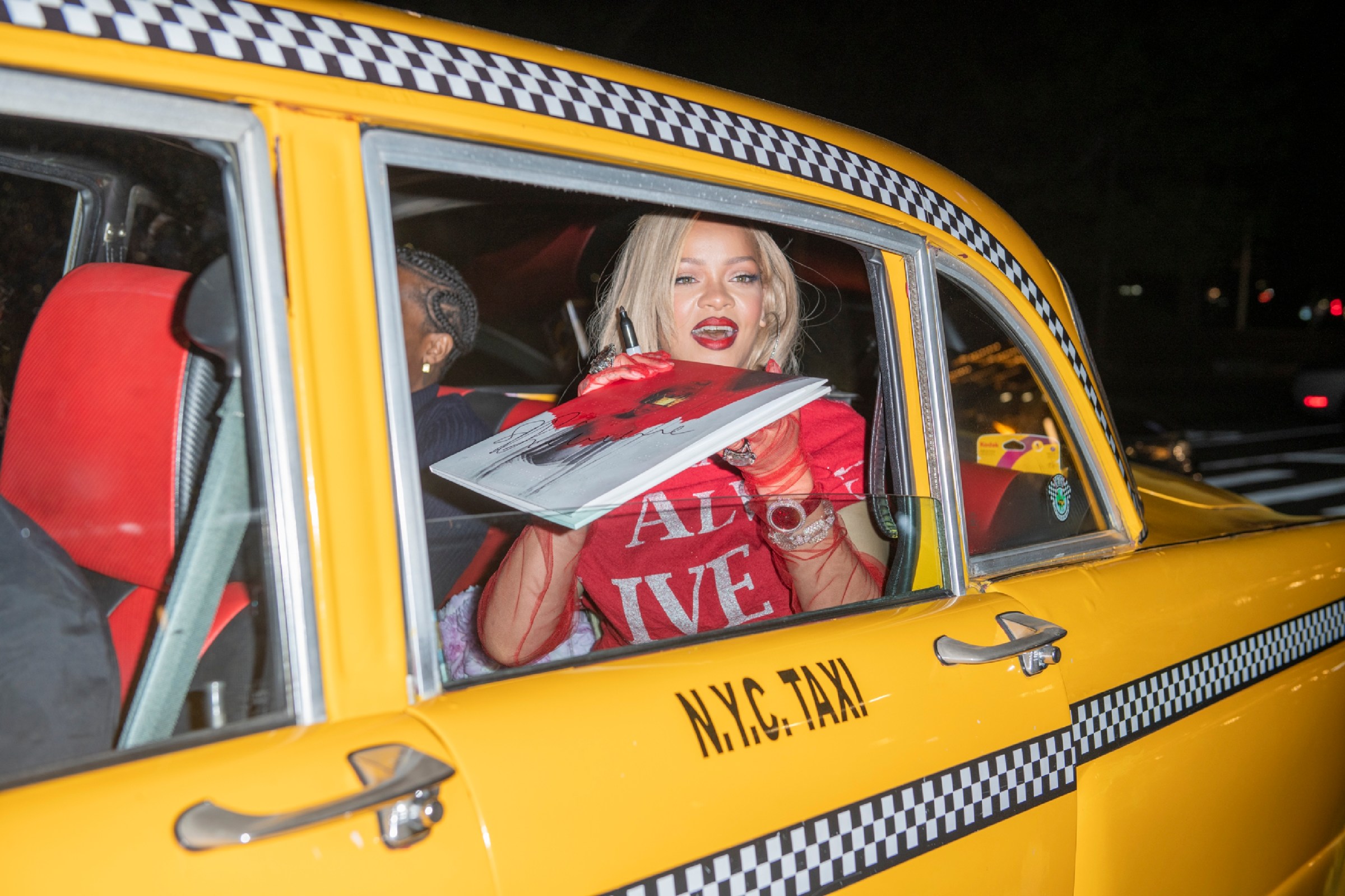 Rihanna and A$AP Rocky in a taxi in New York City.