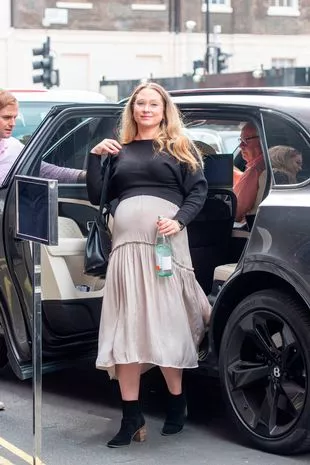 Natalie showed off her ever-growing baby bump