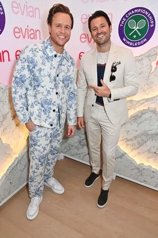 Olly Murs and Mark Wright pose in the evian 'Mountain Of Youth' VIP suite during day 8 of Wimbledon 2024 on July 8 2024