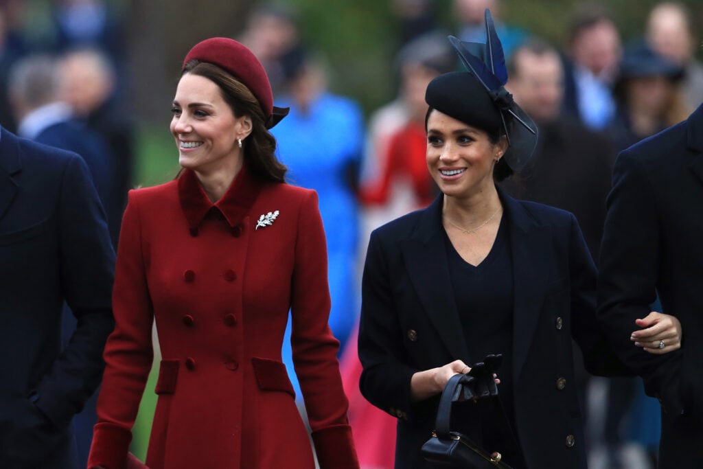 Catherine, Duchess of Cambridge and Meghan, Duchess of Sussex arrive to attend Christmas Day Church service at Church of St Mary Magdalene on the Sandringham estate on December 25, 2018 in King's Lynn, England. 