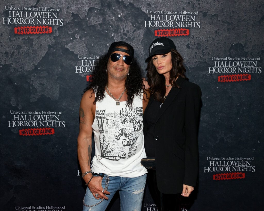 Slash and Meegan Hodges attend the âHalloween Horror Nightsâ Opening Night at Universal Studios Hollywood on September 09, 2021 in Universal City, California. 