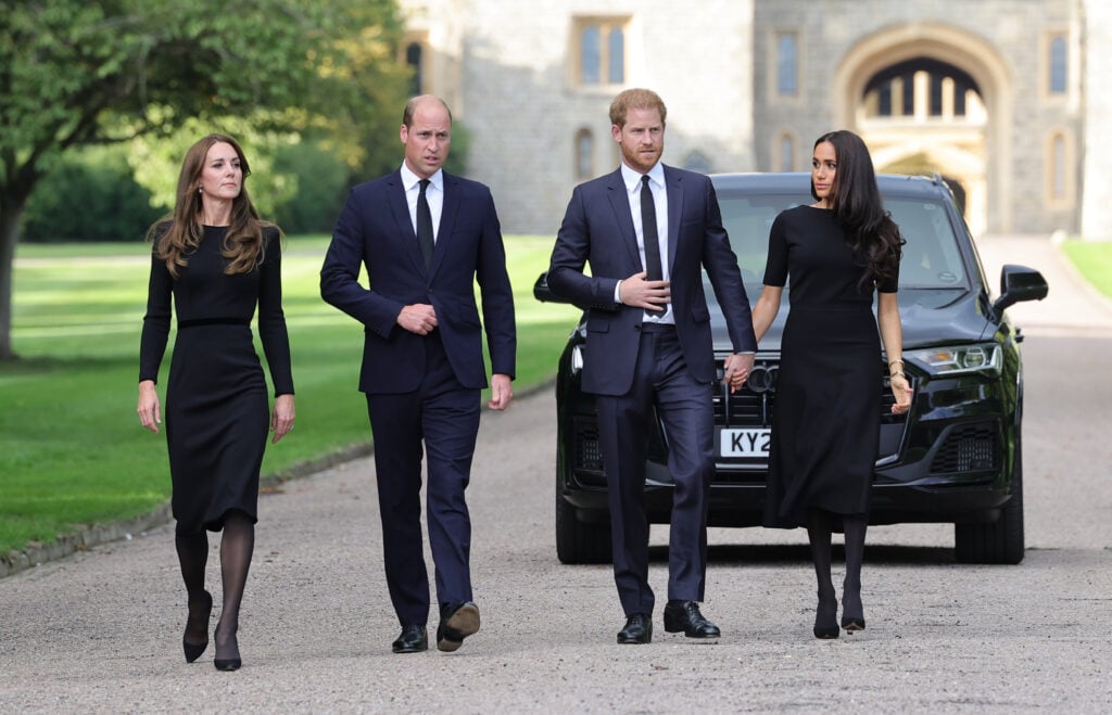 Catherine, Princess of Wales, Prince William, Prince of Wales, Prince Harry, Duke of Sussex, and Meghan, Duchess of Sussex on the long Walk at Windsor Castle on September 10, 2022 in Windsor, England. Crowds have gathered and tributes left at the gates of Windsor Castle to Queen Elizabeth II, who died at Balmoral Castle on 8 September, 2022. 