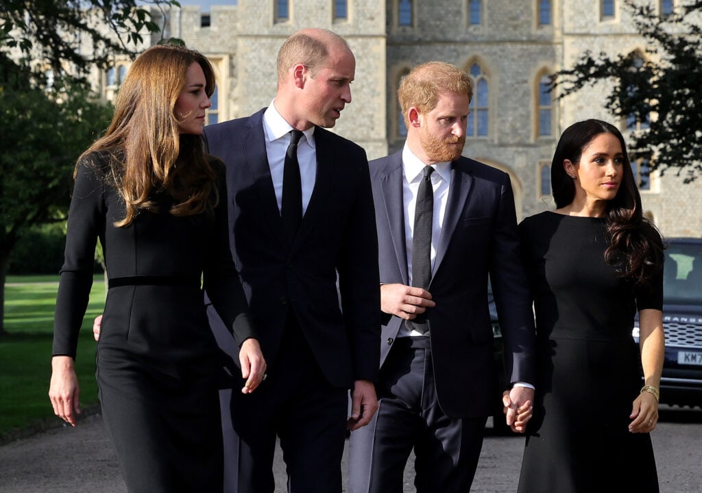 Catherine, Princess of Wales, Prince William, Prince of Wales, Prince Harry, Duke of Sussex, and Meghan, Duchess of Sussex on the long Walk at Windsor Castle arrive to view flowers and tributes to HM Queen Elizabeth on September 10, 2022 in Windsor, England. Crowds have gathered and tributes left at the gates of Windsor Castle to Queen Elizabeth II, who died at Balmoral Castle on 8 September, 2022. 