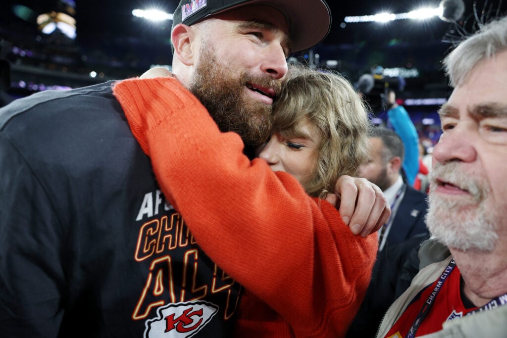 Travis Kelce #87 of the Kansas City Chiefs celebrates with Taylor Swift after a 17-10 victory against the Baltimore Ravens in the AFC Championship Game at M&T Bank Stadium on January 28, 2024 in Baltimore, Maryland. 