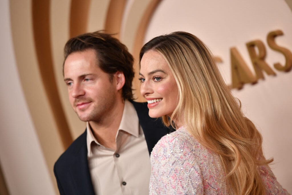 Tom Ackerley and  Margot Robbie attend the Oscar Nominees Luncheon at the Beverly Hilton in Beverly Hills, California, on February 12, 2024. 