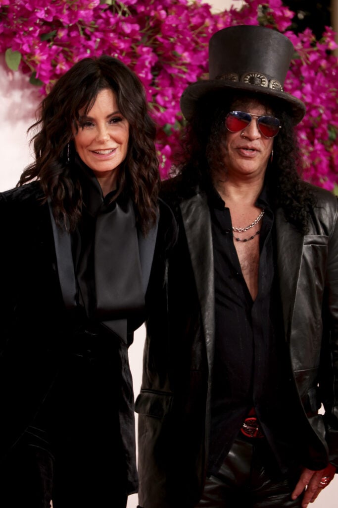 HOLLYWOOD, CALIFORNIA - MARCH 10: (L-R) Meegan Hodges and Slash attend the 96th Annual Academy Awards on March 10, 2024 in Hollywood, California. 