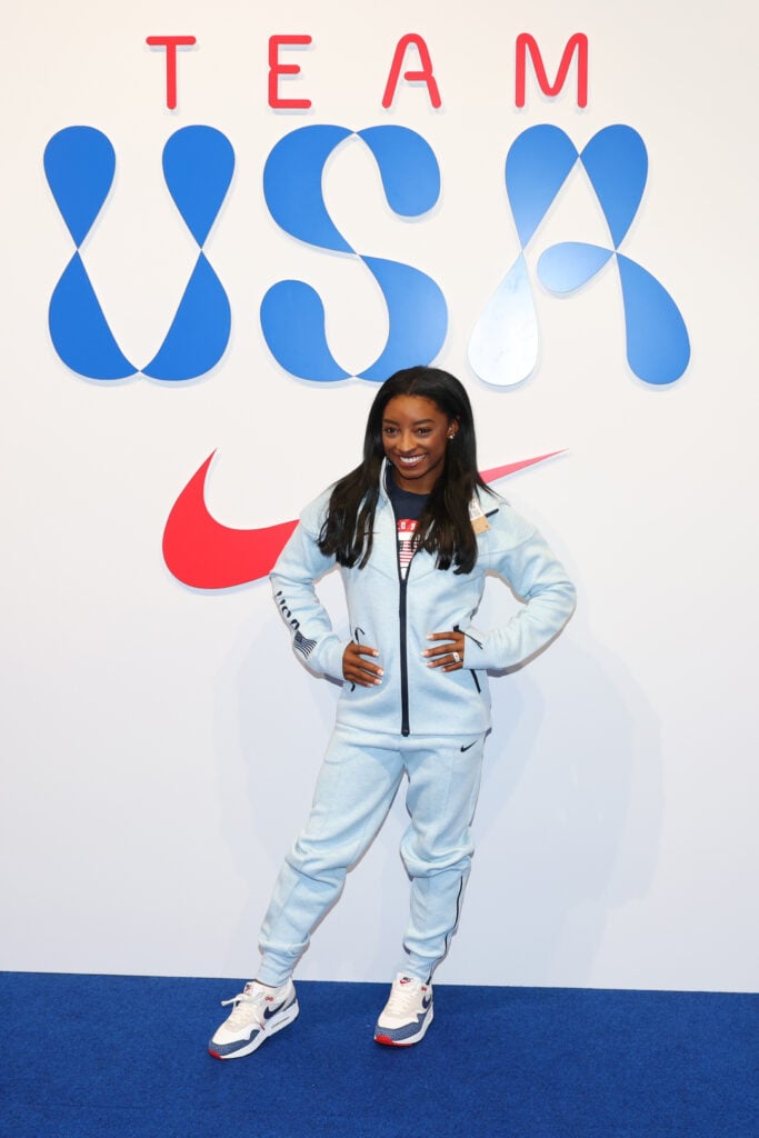 Simone Biles tries on clothes at the Team USA Welcome Experience Ahead of Paris 2024 on July 22, 2024 in Paris, France.  