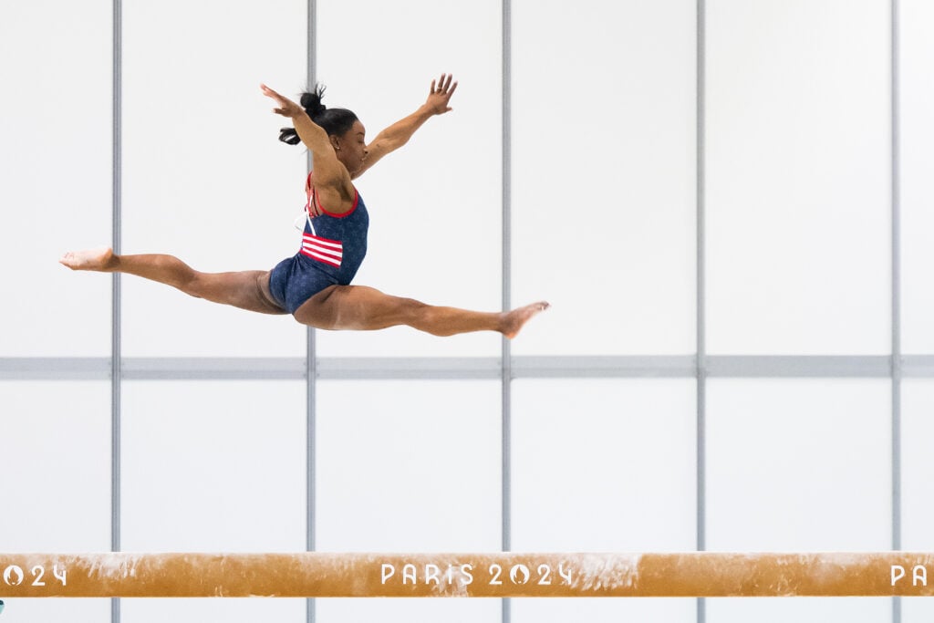 Simone Biles of Team United States practices on the balance beam during a gymnastics training session ahead of the Paris Olympic Games at Gymnastic Training Centre of Le Bourget on July 23, 2024 in Le Bourget, France. 