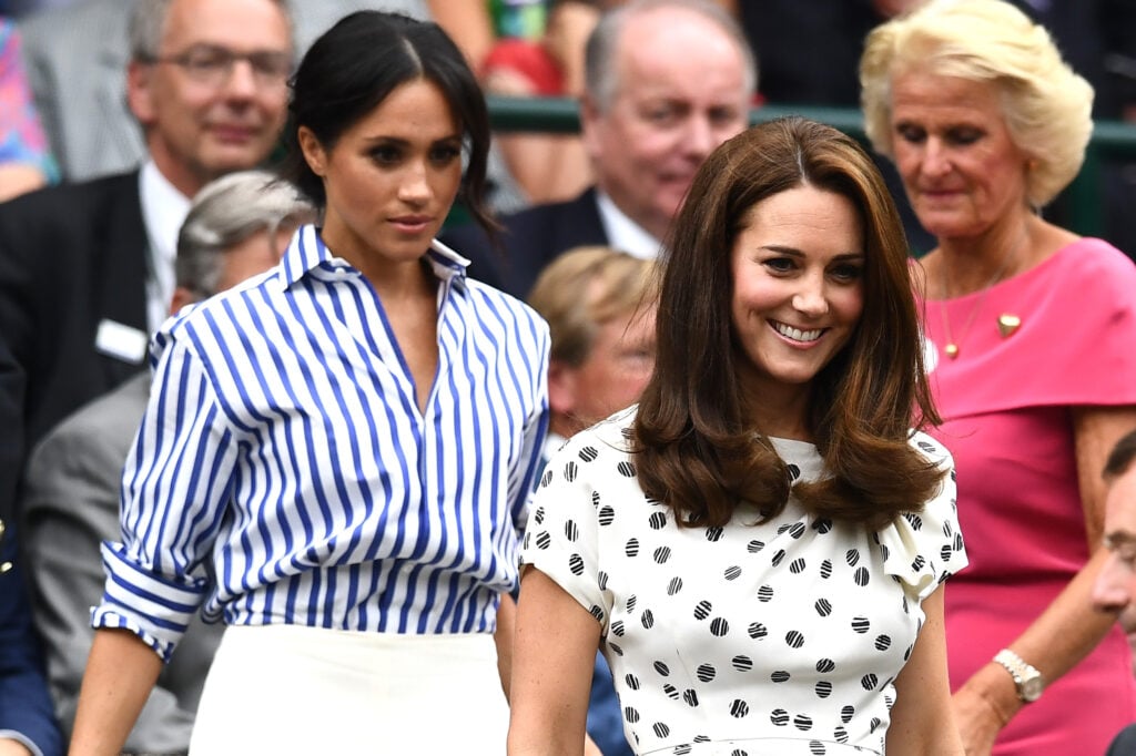 Meghan, Duchess of Sussex and Catherine, Duchess of Cambridge attend day twelve of the Wimbledon Lawn Tennis Championships at All England Lawn Tennis and Croquet Club on July 14, 2018 in London, England.  