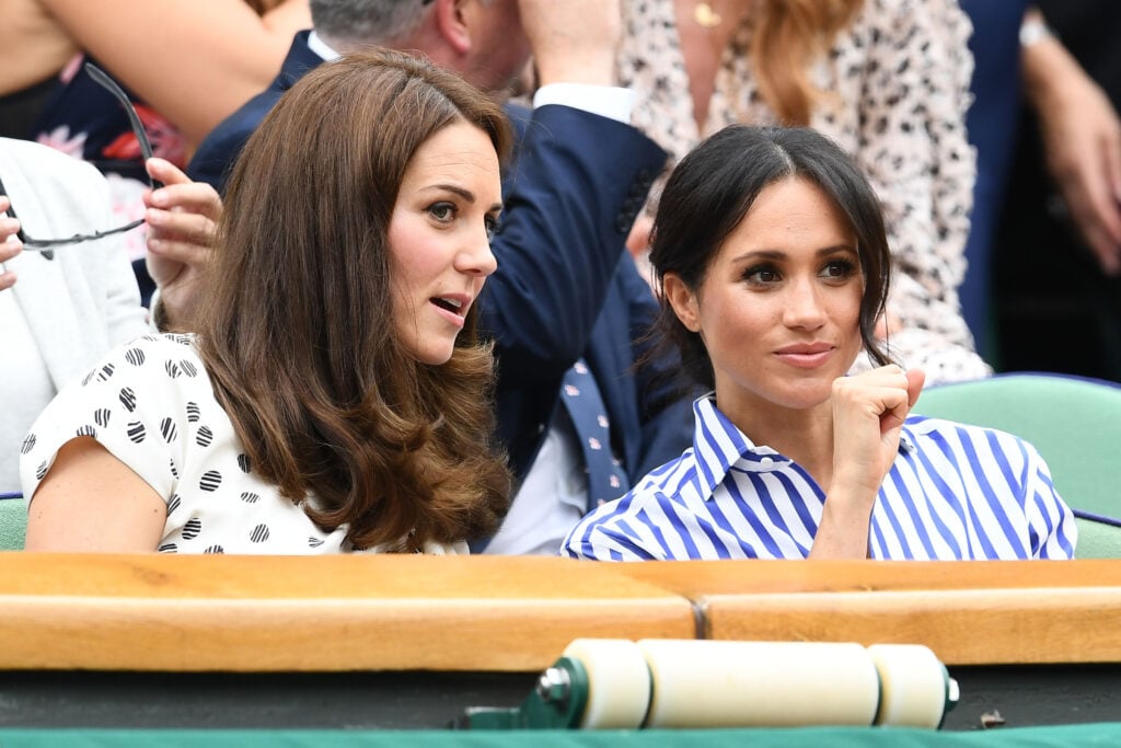 Catherine, Duchess of Cambridge and Meghan, Duchess of Sussex attend day twelve of the Wimbledon Lawn Tennis Championships at All England Lawn Tennis and Croquet Club on July 14, 2018 in London, England.  